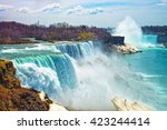 Niagara Falls from the American side in spring. A view from Niagara State Park on American Falls, Bridal Veil Falls, Goat Island and Horseshoe falls on the background.