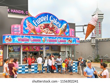 NIAGARA FALLS, CANADA - AUGUST 6, 2018: Funnel Cake Stand Serves Carnival Desserts On One Of The Major Tourist Promenades In Niagara Falls, Ontario.