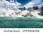 Niagara Falls. Looking from below, Falling water crashes on stones