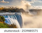 Niagara Falls, New York, USA from the rim of the falls on an autumn dusk.