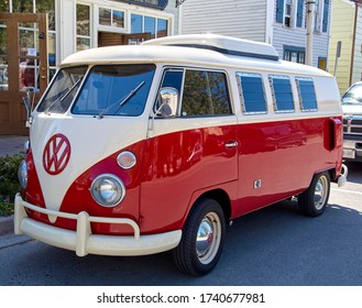 Niagara Falls, Ontario, Canada - may 25 2008: A photograph of a vintage red Volkswagen, front side view of van headlight and details. Shining classical Red & white coloured German Volkswagen mini Bus.