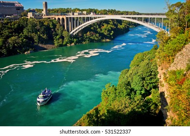 Niagara Falls, USA - September 24, 2016: Ferry Maid of the Mist and Rainbow Bridge. Niagara River. Niagara Falls. - Shutterstock ID 531522337