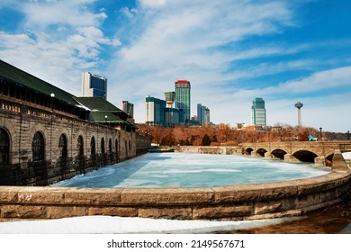 Niagara Parks Power Station View With Ice Frozen Water And Town On Background