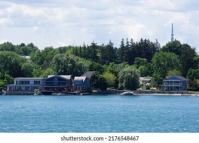 Niagara-on-the-Lake, Ontario, Canada - June 10, 2022: View of houses on the waterfront of Lake Ontario