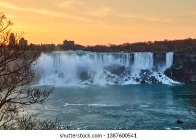 Niagra Falls During Sunrise With The City At The Background