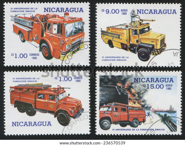 Nicaragua - CIRCA 1985: Set of\
postage stamp printed in Nicaragua, shows various models of fire\
engines. Red and yellow vehicles. Fire fighting., circa\
1985
