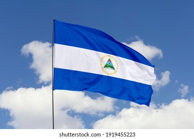 Nicaragua flag isolated on the blue sky with clipping path. close up waving flag of Nicaragua. flag symbols of Nicaragua.