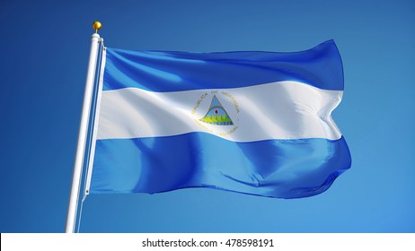 Nicaragua flag waving against clean blue sky, close up, isolated with clipping path mask alpha channel transparency