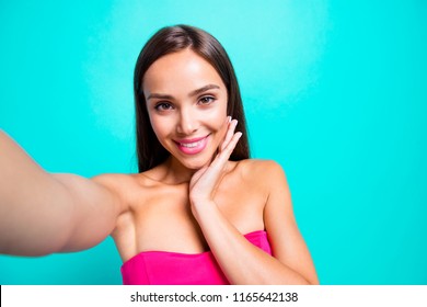 I'm so nice and adorable! Close up photo portrait of pretty sweet with ideal perfect skin lady taking making selfie on smart phone isolated on bright vivid shinny background