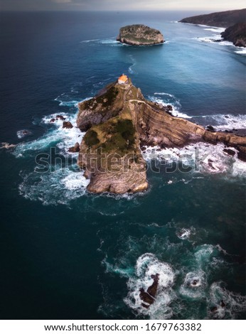 Similar – Image, Stock Photo Green rocky coast at a calm sea in northern Spain