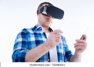 Nice attractive man using a digital device