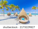 Nice beach with beach chairs, thatched umbrellas and palm trees. luxury beach against the background of the beauty of the sea with coral reefs. summer holiday. Wonderful and beautiful Cuba, Varadero