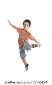A nice brazilian and caucasian kid jumping in the air, wearing a nice orange t shirt, short jeans and tennis. Isolated on white.