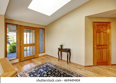 Nice bright entry way to home with hardwood floor and rug. Nortrhwest, USA - Shutterstock ID 469449404