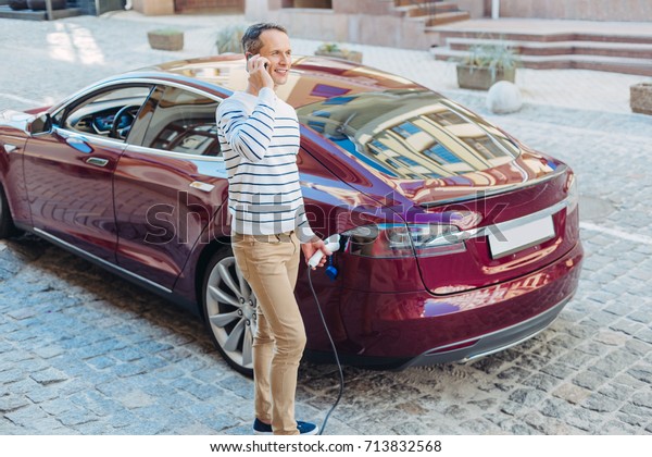 Nice busy man refilling his
car