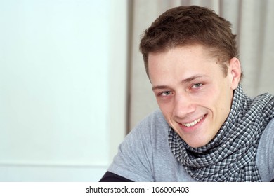 Nice Caucasian male sitting at a table in a cafe