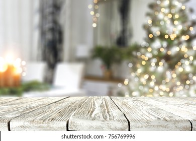 a nice Christmas tree with a green tree and a wooden table ideal for advertising or text