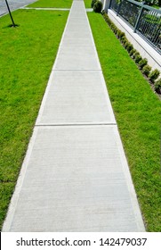 Nice And Clean Long, Strait Sidewalk, Path At The Empty Street. Neighborhood Scenery.