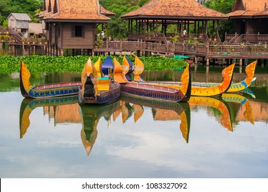 Nice and colourful ancient looking wooden Khmer boats at the floating village in the Cambodian Cultural Village in Siem Reap, Cambodia.