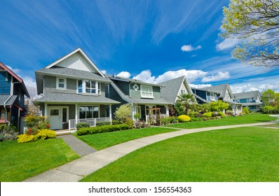 Nice and comfortable neighborhood. A row, line of the houses, homes in the suburbs of the North America. Canada.