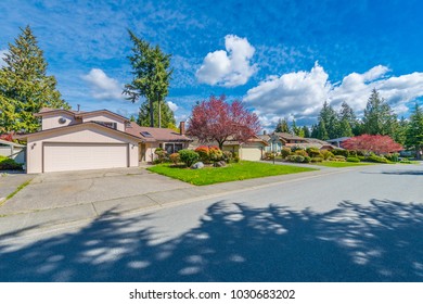 Nice And Comfortable Neighborhood. Some Homes On The Empty Street In The Suburbs Of Vancouver, Canada.