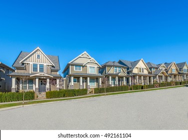 Nice And Comfortable Neighborhood. Some Homes On The Empty Street In The Suburbs Of Vancouver, Canada.