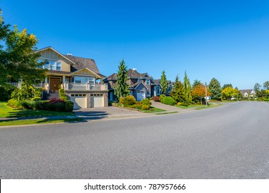 Nice and comfortable neighborhood. Some homes on the empty street in the suburbs of Vancouver, Canada.
