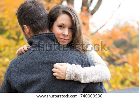 A nice couple in love in a park consoling