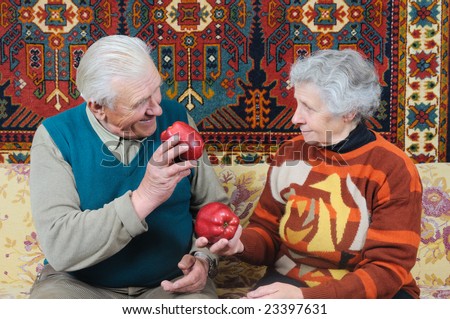 nice couple with two red ripe apple