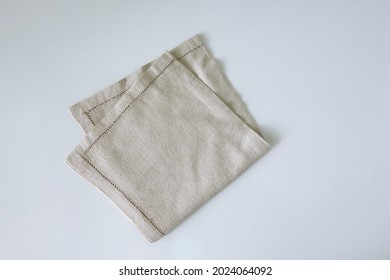 nice design of table napkin vintage style isolated on white background. Single dish textured fabric cloth view from top for food decoration and packaging design             