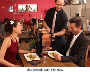 Nice Dinner In A Restaurant - Waiter Offers Pepper