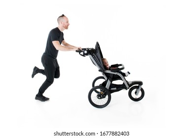 A Nice Father Jogging With A Baby Stroller