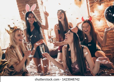 Nice feminine attractive gorgeous well-groomed lovely royal funny cheerful group ladies bride-maids having fun time congrats greetings in golden decorated loft industrial style interior room house