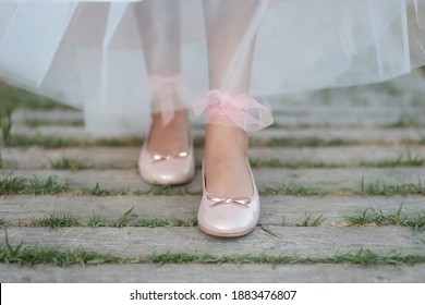 Nice flat pink summer lady shoes. Ballerina shoes on a beautiful floor. 