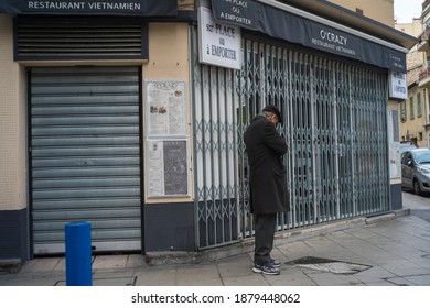 Nice, France - 01 10 2018: A Man Stands In Front Of An Asian Restaurant Closed By The Crisis.