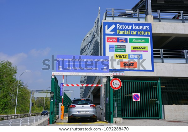 NICE, FRANCE -23 APR 2018- View of a sign for\
rental car returns at the Nice Cote d\'Azur Airport (NCE) on the\
French Riviera.