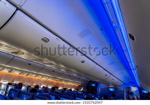 Nice,\
France - 24.10.2021 : Emirates Airlines aircraft cabin with\
passengers watching TV screen. High quality\
photo