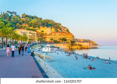 NICE, FRANCE, JUNE 11, 2017: People Are Strolling On Promenade Des Anglais In Nice, France
