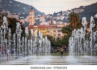 Nice, France - November 3, 2016:  People Walk On A Promenade Du Paillon Park, Famous With Its Flat Fountains In Nice, France. 