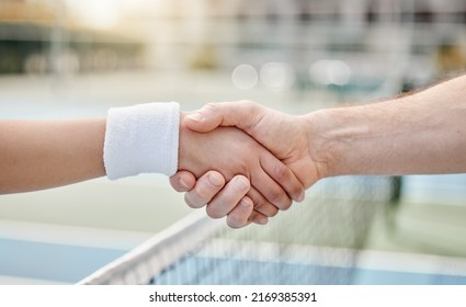 Nice game. Cropped shot of two unrecognizable tennis players shaking hands while standing outside on a court. - Powered by Shutterstock