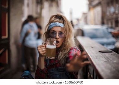 Nice girl drinking a beer. Beautiful woman drinking a beer. 