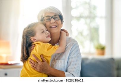 A nice girl and her grandmother enjoying sunny morning. Good time at home.  - Powered by Shutterstock