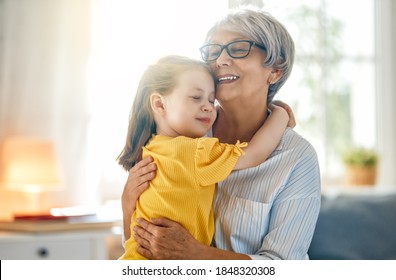 A nice girl and her grandmother enjoying sunny morning. Good time at home.  - Powered by Shutterstock