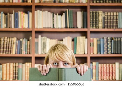 Nice girl hiding behind a book