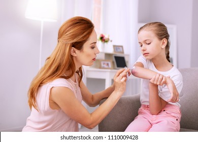 Nice Good Looking Applying Ointment While Looking At The Girls Wound