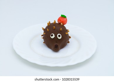 Nice Hedgehog Cake On White Plate Isolated