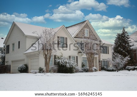 A nice house after a snow storm