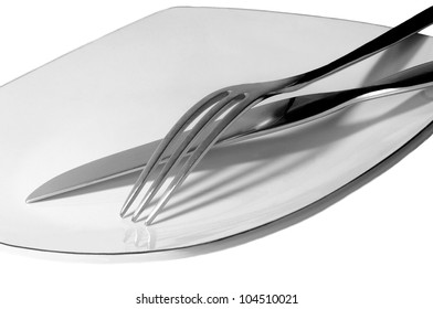 Nice isolated Image of a Knife and fork on plate