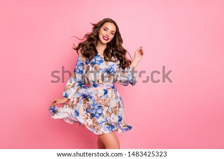 Nice lady overjoyed by warm spring breeze going romantic date wear cute dress isolated pink background