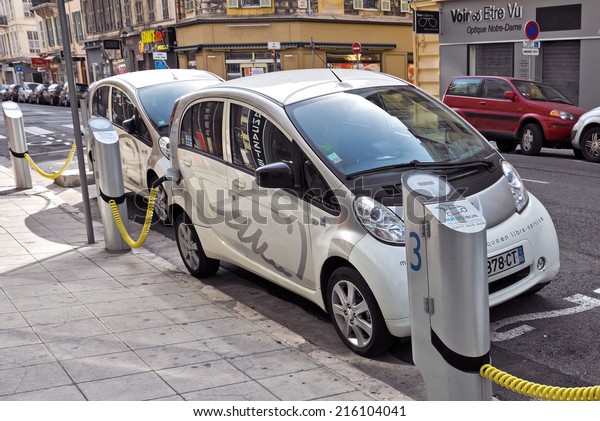 NICE - MAY 1: Electric cars at a charging\
station on May 1, 2013 in Nice, France.\
